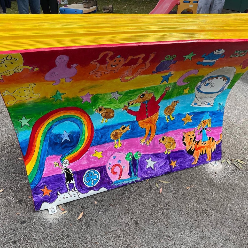 Back Book bench covering in childrens drawings