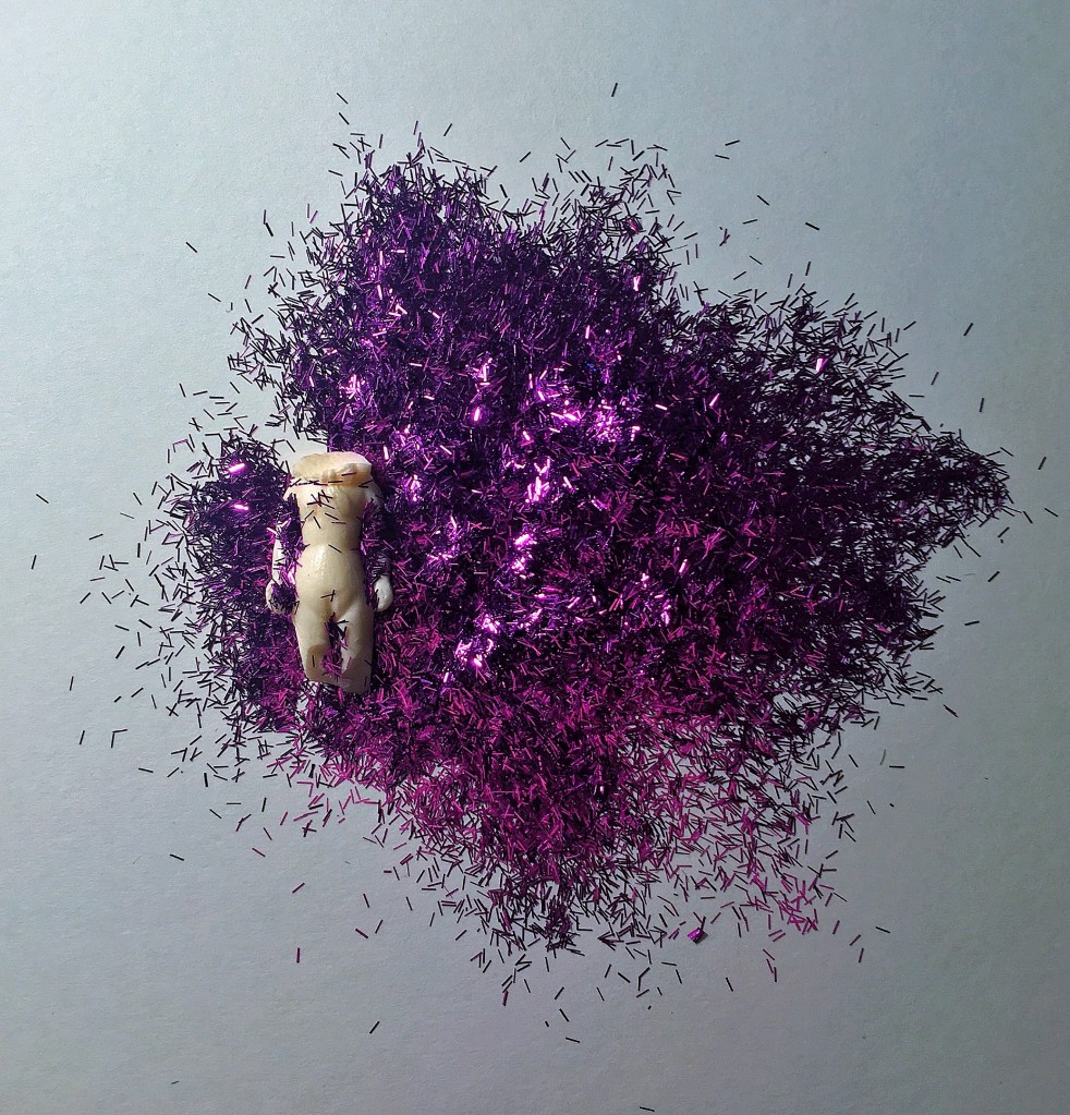 Objectivity works - small figure covered in glitter